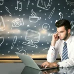 Businessman sitting at table with hand drawn social media icons and symbols-1